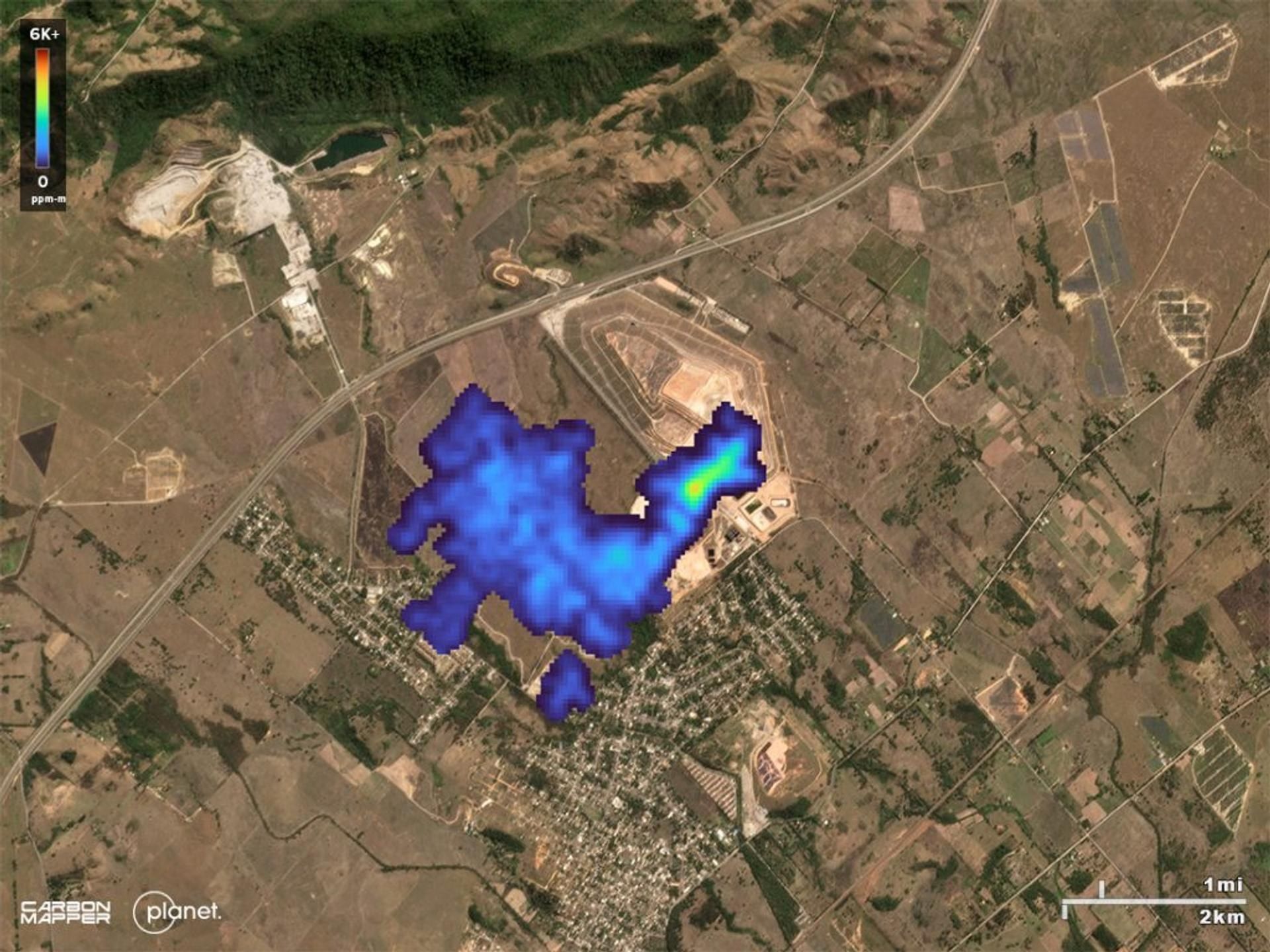 Methane plume drifting over a town